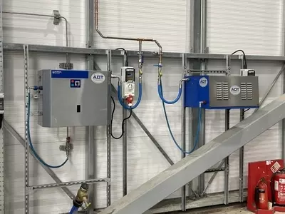 Nilfisk SC Uno and DTE pressure washers mounted on UniStrut framing at a logistics facility in Ellistown.